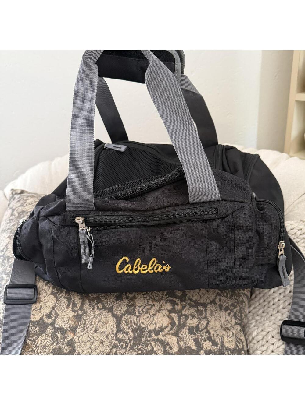 Mini / Small Cabellas travel duffle black with spell out LOGO, lots of pockets